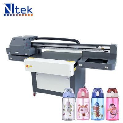 Yc6090 Small UV Flatbed Printer Printing on Bottles